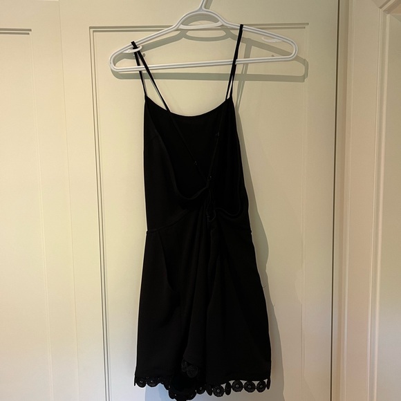 Black romper with crossbody back - Picture 2 of 3